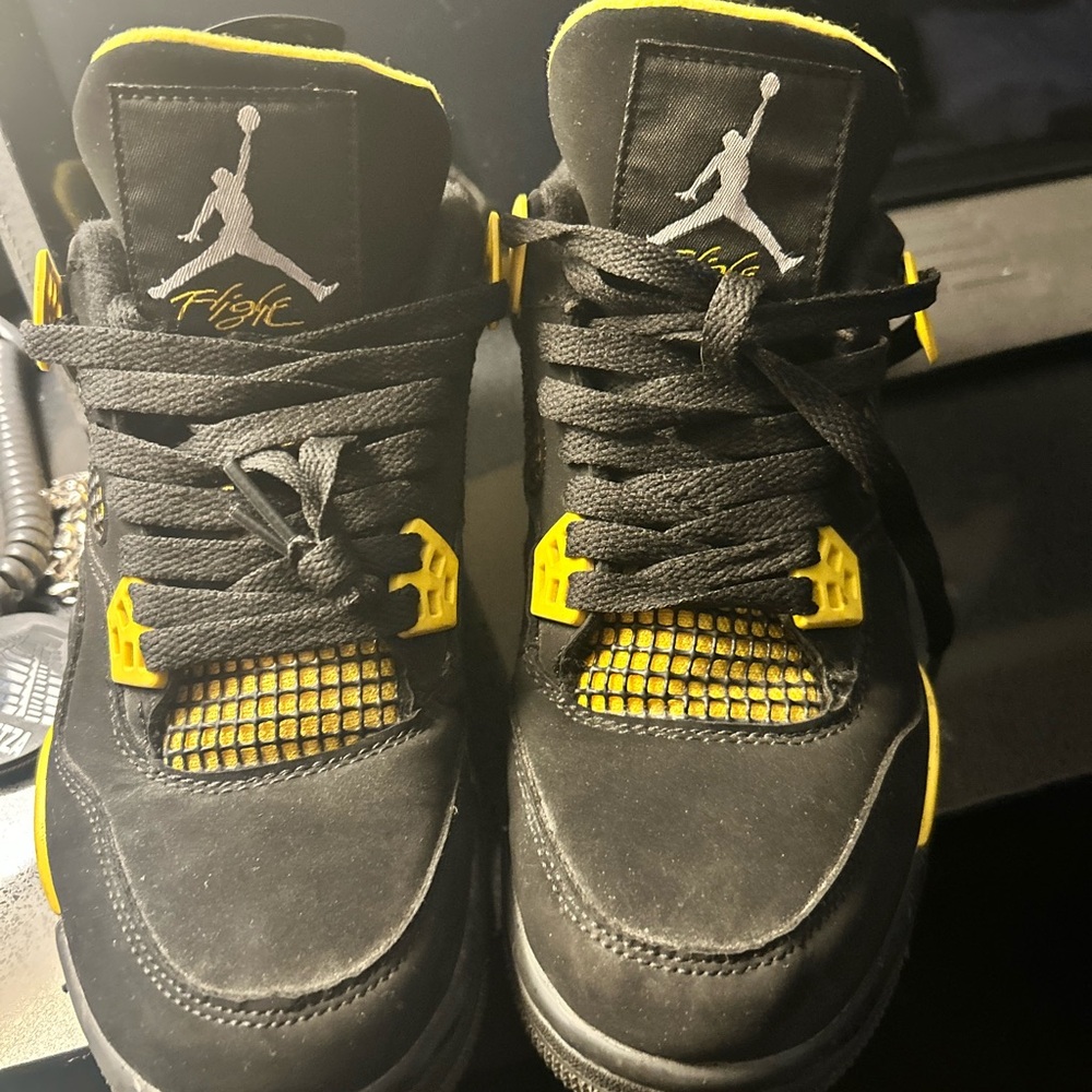 Black and Yellow Jordan 4s